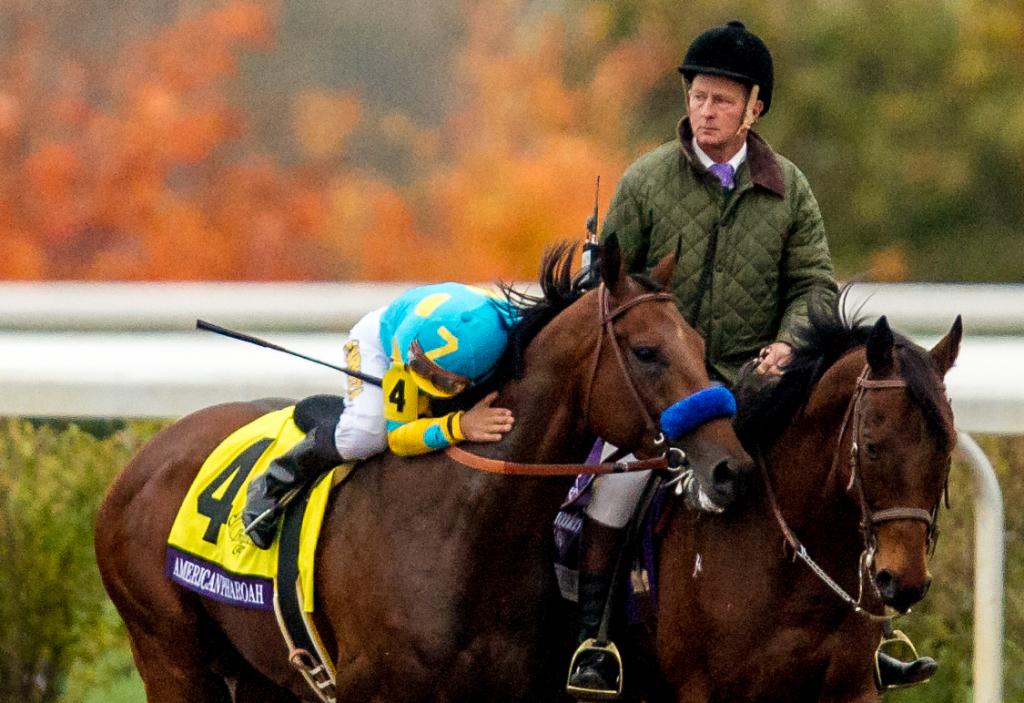 Espinoza gives American Pharoah a hug after their Breeders' Cup win. (Eclipse Sportswire)